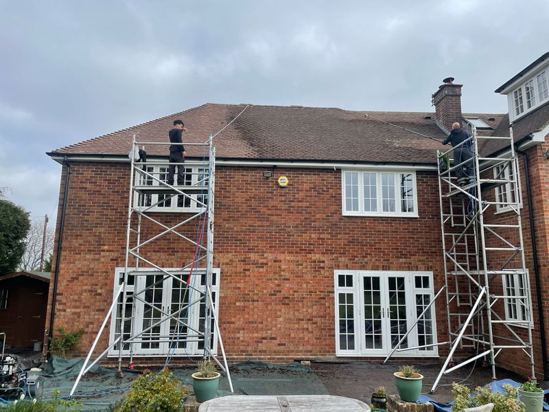 Roof cleaning carried out safely from scaffold towers by The Roof Moss Cleaners in Filton